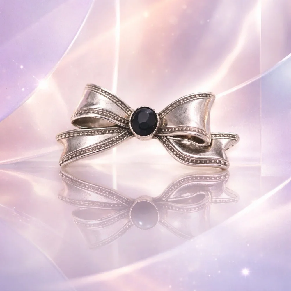 Silver Tone Bow Brooch with Black Center
